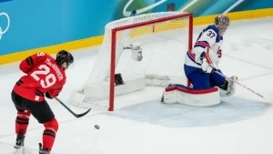 Nathan MacKinnon reacts after Canada’s Olympic final loss in Milan